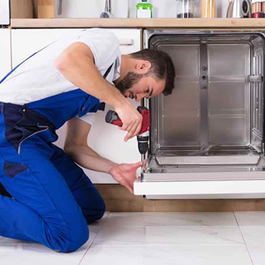 a professional repairing in the kitchen